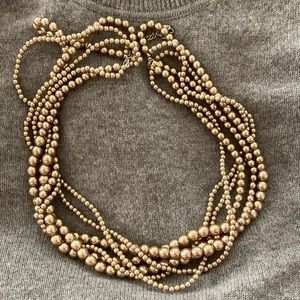 Gold bead twist necklace. Had a bunch of these. Versatile and pretty.